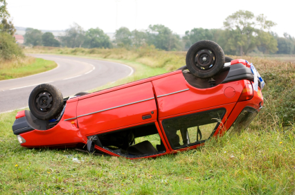 red car upside down after accident
