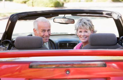 Over 50 couple enjoying a drive